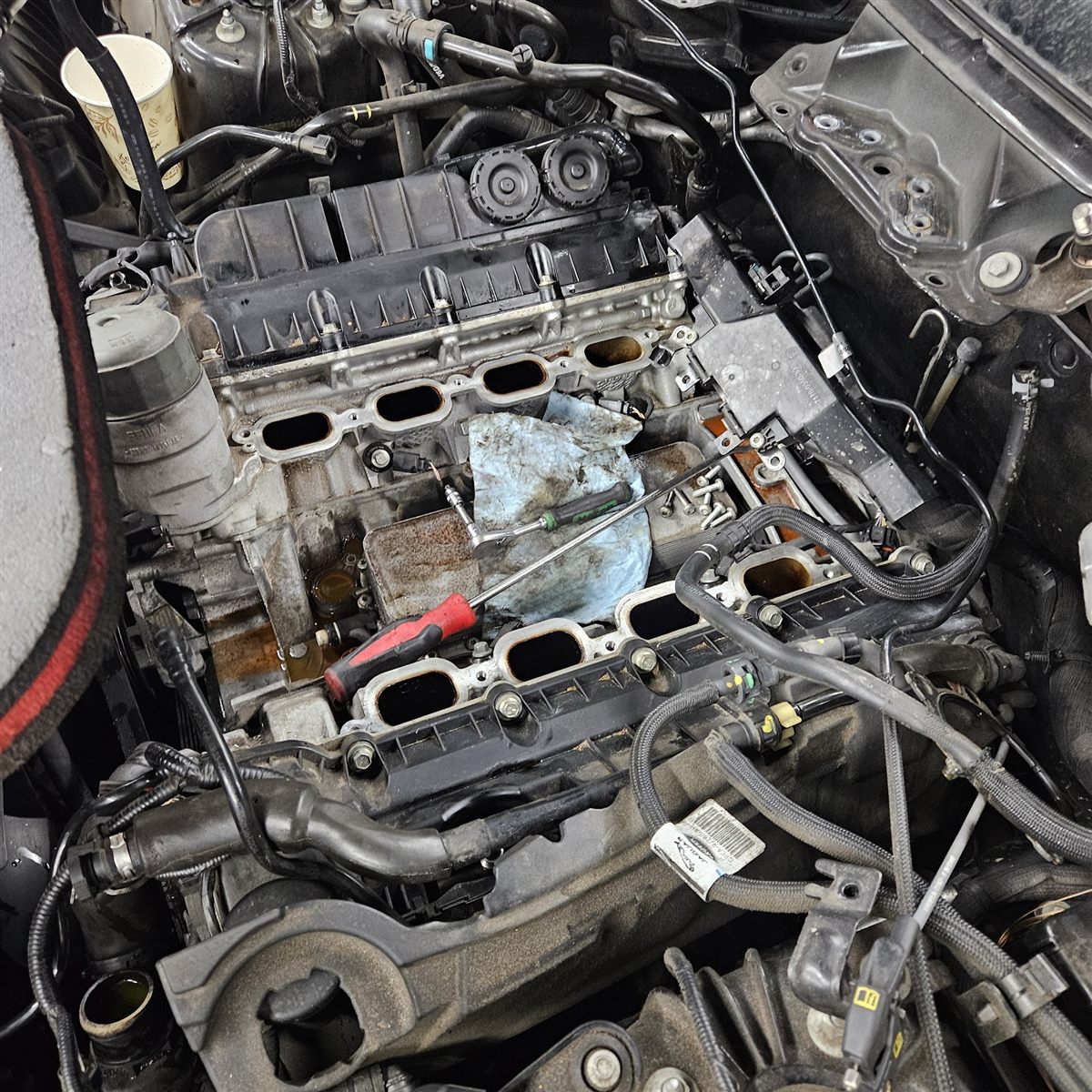 An engine with the intake manifolds removed during a repair at Dave's
